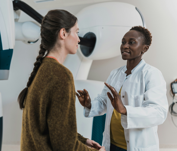 Radiology Tech speaking with patient